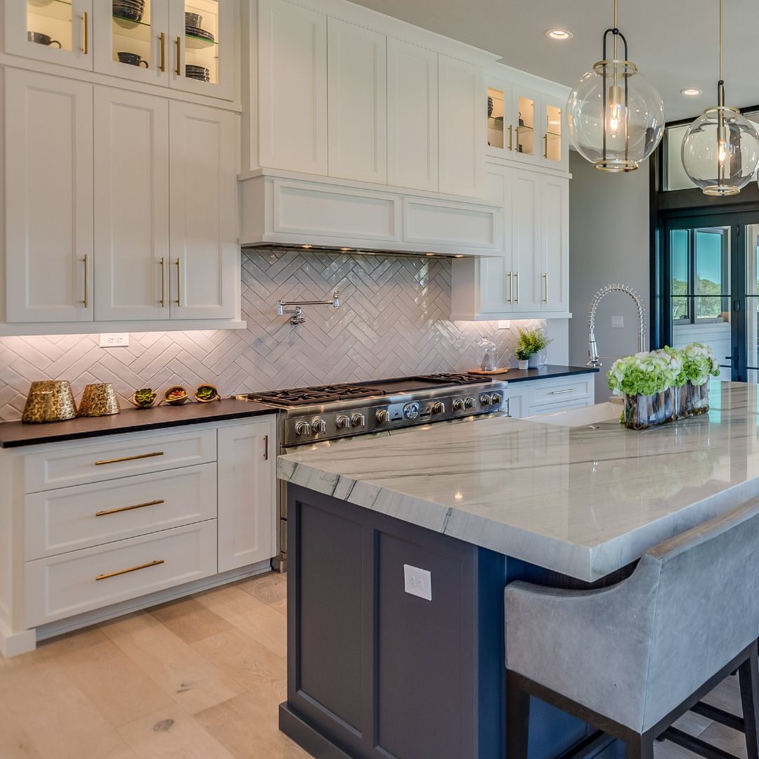 Contemporary Open-Concept Kitchen
A contemporary open-concept custom kitchen with sleek gray cabinetry, a quartz waterfall island, and built-in LED under-cabinet lighting.