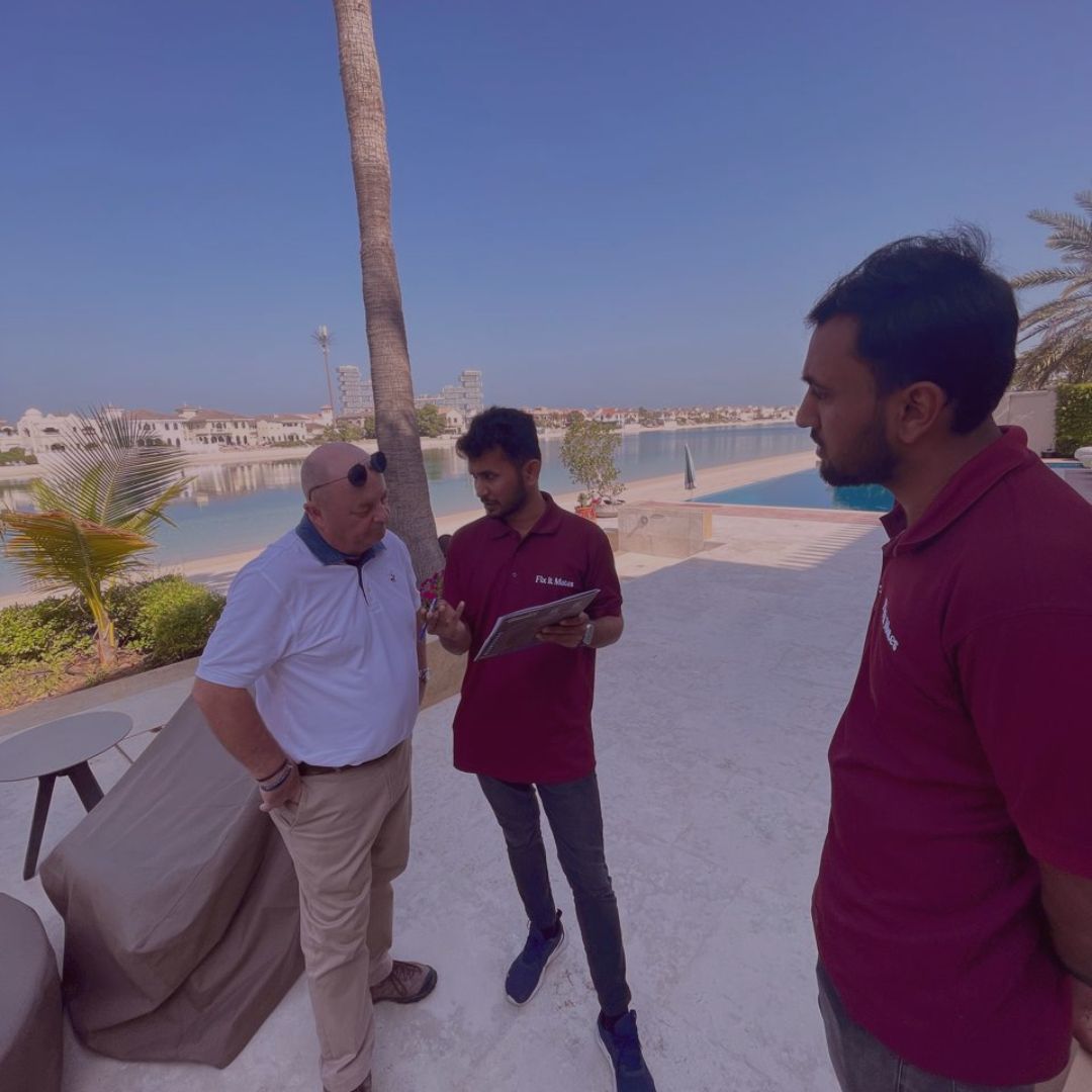 Fix It Mates team discussing annual maintenance contract (AMC) details with a customer in Palm Jumeirah, ensuring comprehensive service plans tailored to the client's needs for property upkeep and maintenance.